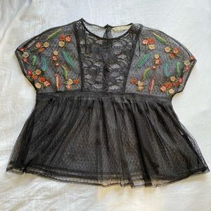 Sheer black blouse with embroidered flowers